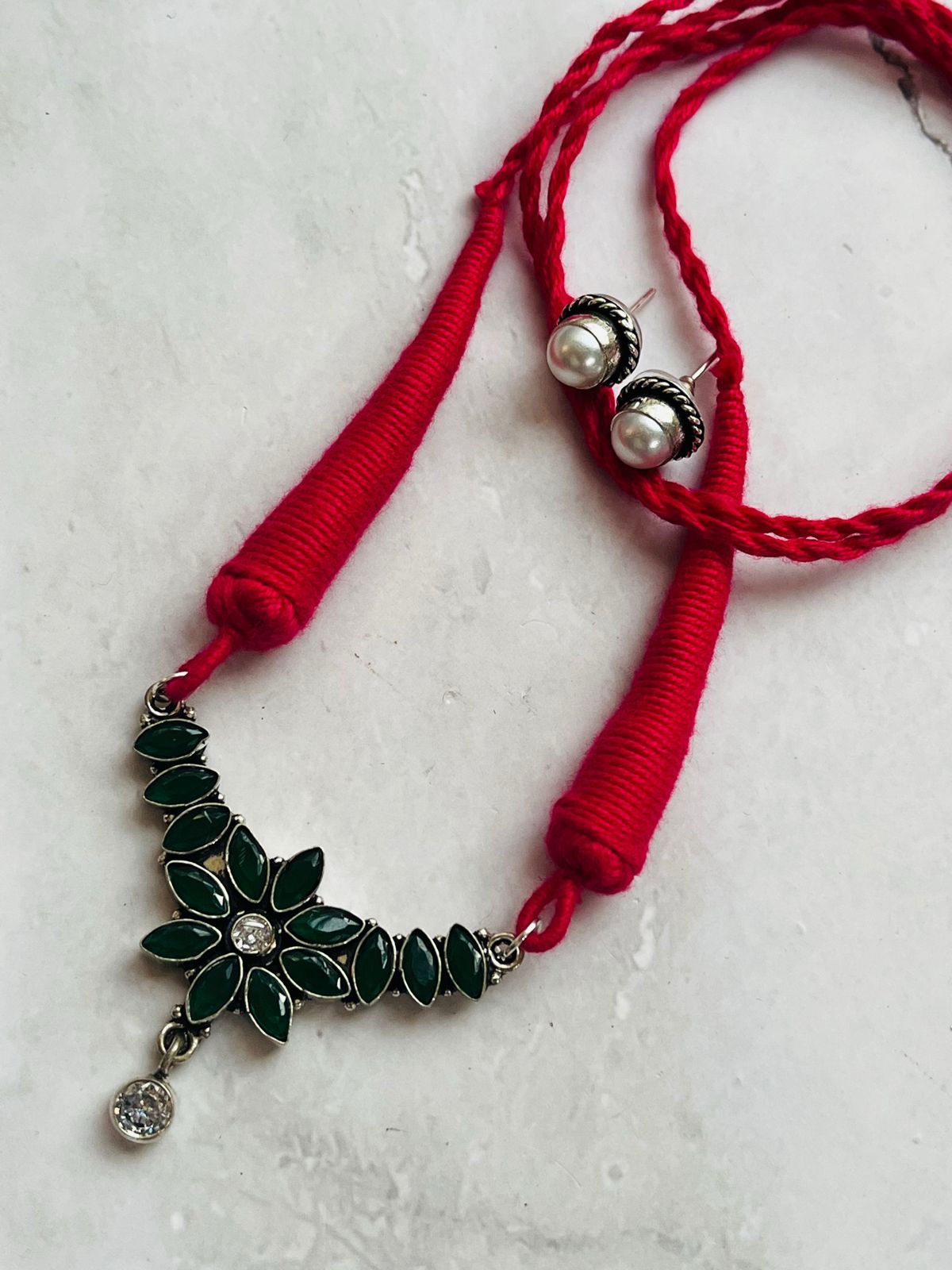 Handcrafted Red Thread Necklace with Green Stone Floral Pendant